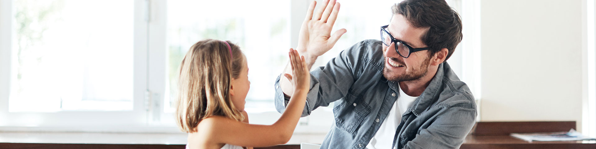 man and child high fiving